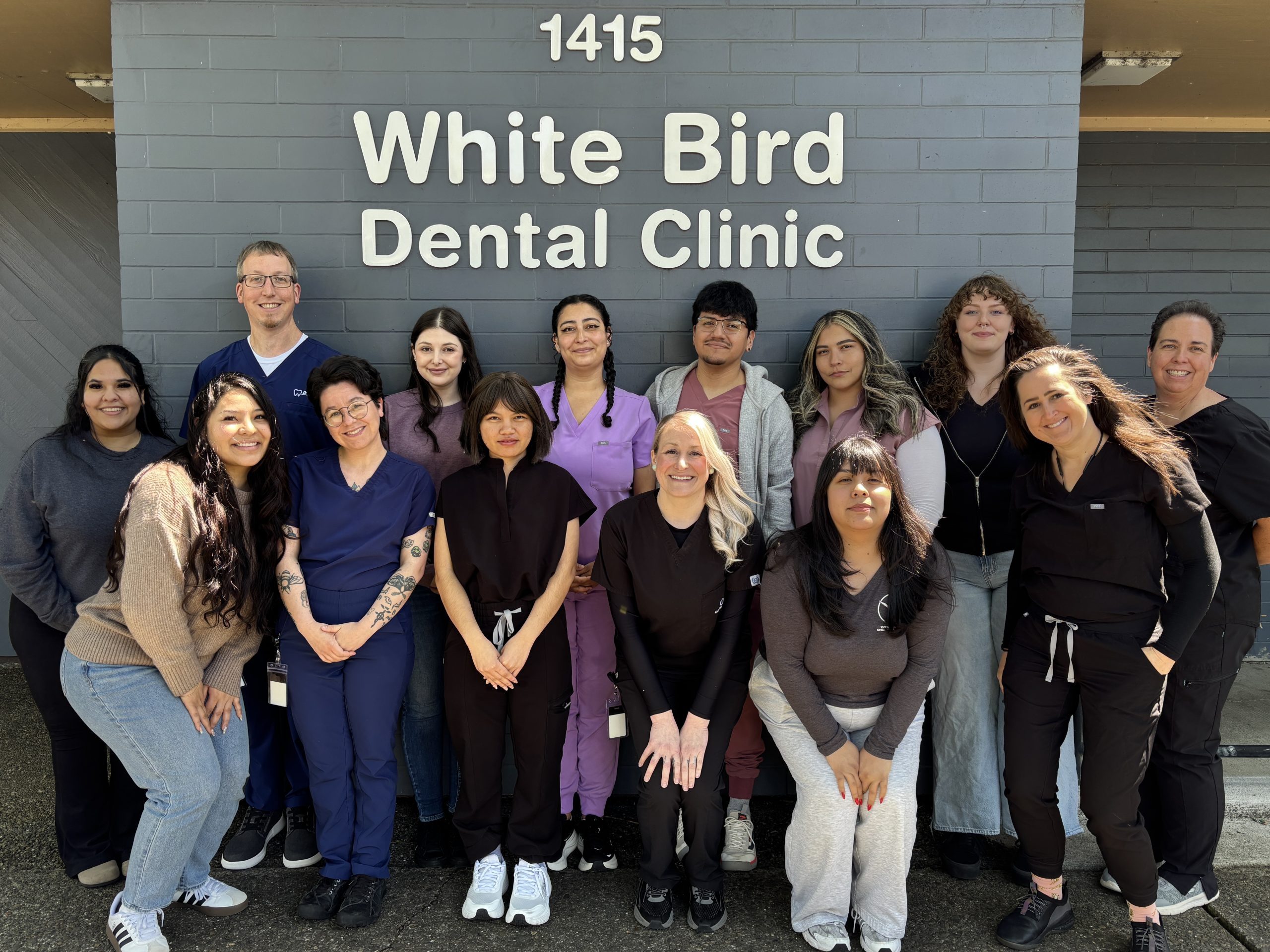 Dental All Staff A photo of all the dental staff, assembled under the "White Bird Dental Clinic" sign.